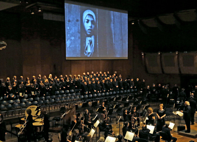 The Orchestra of Terezin Remembrance and the City Choir of Washington performing “Defiant Requiem” at Avery Fisher Hall in 2013.