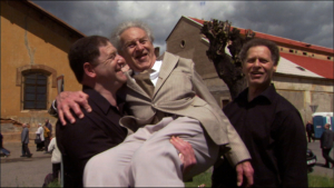 Terezín Chorus Survivor Edgar Krasa is lifted into the air by his son Rafael – named for Rafael Schächter – as older brother Daniel (Dani) looks on in a scene from the award-winning documentary, Defiant Requiem. Photo credit: Partisan Pictures