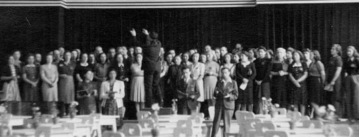 The only known photo of Theresienstadt inmates performing Verdi’s Requiem Mass, taken during the final performance on June 23, 1944. Rafael ‘Rafi’ Schächter is seen conducting the choir, with members of the Nazi command and an International Red Cross delegation in the audience. (Courtesy of The Terezín Foundation)